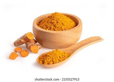 Turmeric powder in wooden bowl and spoon isolated on white background.