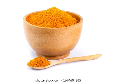 Turmeric or tumeric powder ( curcumin, Curcuma longa Linn) in wooden bowl and spoon isolated on white background.  - Powered by Shutterstock
