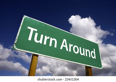 Turn Around Road Sign With Dramatic Clouds And Sky.