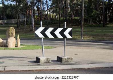 Turn Left Road Sign On A Roundabout On A Street