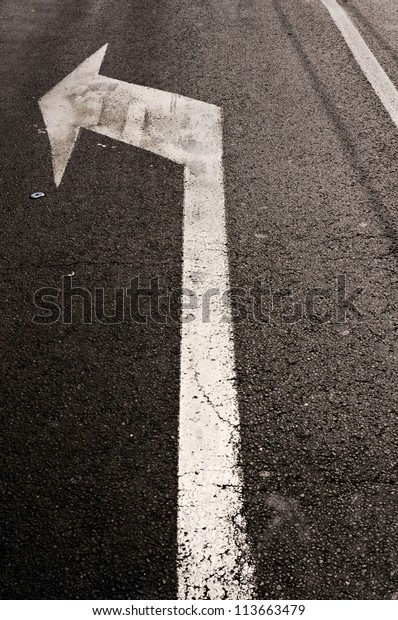 Turn left sign on te\
street