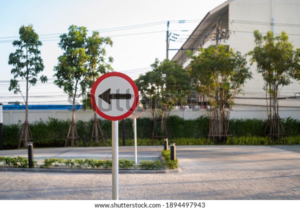 Turn left traffic
sign on outdoor background