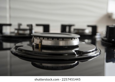 Turn off gas stove in the kitchen. Gas crisis concept - Shutterstock ID 2257451445