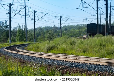 Turn Of The Railway Road In The Forest, Outgoing Freight Train. Landscape With Train