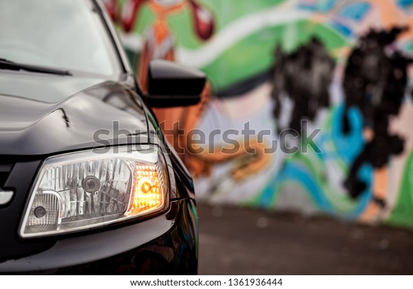 turn signal headlight of\
black car
