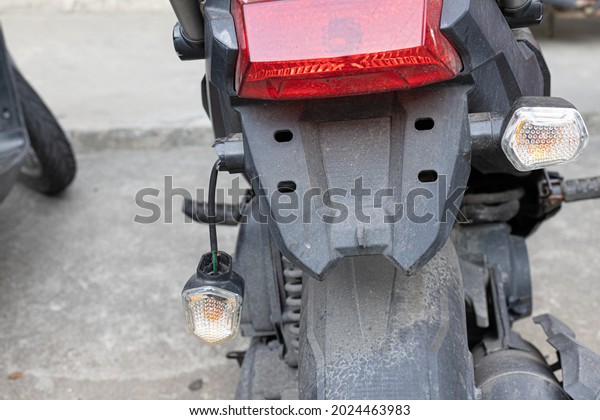 Turn\
signal on the left side of the rear of the motorcycle. to show\
changing lanes for road safety damaged or\
broken