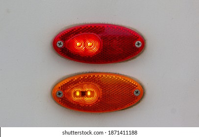 The Turn Signal On The Tram. Rear Lamp Signals For Turn Of Car On Street. Orange Light Turn Signal Before Turn Vehicle To The Left Direction. Safety Drive Concept Without Accident