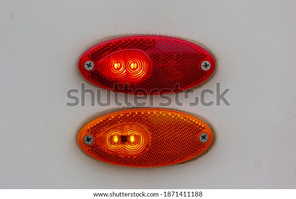 The turn\
signal on the tram. Rear lamp signals for turn of car on street.\
Orange light turn signal before turn vehicle to the left direction.\
Safety drive concept without\
accident