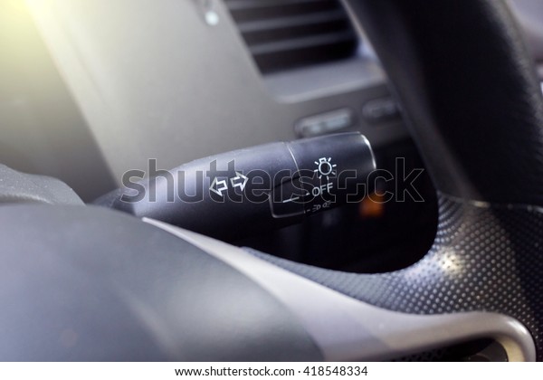 Turn signal switch in cars with gradient filter,\
Car interior