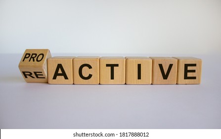 Turned a cube and changed the word reactive to proactive. Business concept. Beautiful white background, copy space.