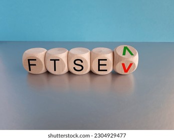 Turned a cube and changes the direction of an arrow symbolizing that the FTSE 100 Index is changing the trend and goes up instead of down. Symbol for the FTSE 100 Index. 