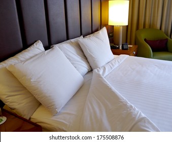 Turned Down Bed In Hotel Room