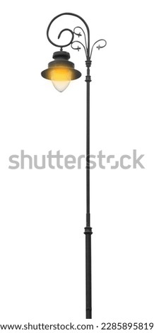Turned on street lamp in old fashion style isolated on white