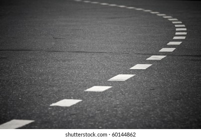 Turning asphalt road with marking lines. Close up photo - Powered by Shutterstock