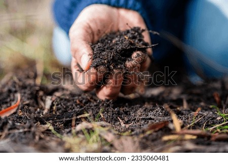 turning a compost pile in a community garden. compost full of microorganisms. sustainable regenerative agriculture Foto stock © 