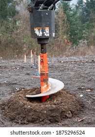 Turning Drill Auger With Ground And Dirt. The Auger, Industrial Ground Drilling Rig Making A Hole.