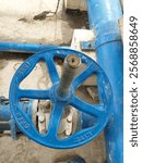 Turning handwheel on the gate valve