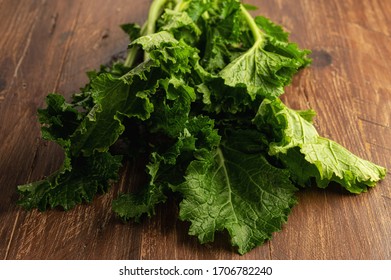 Turnip Greens On A Wooden Table