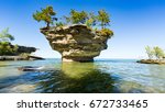 Turnip Rock on Lake Huron in Port Austin Michigan. An underwater view shows rocks under the clear surface of the water