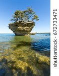 Turnip Rock on Lake Huron in Port Austin Michigan. An underwater view shows rocks under the clear surface of the water