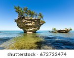 Turnip Rock on Lake Huron in Port Austin Michigan. An underwater view shows rocks under the clear surface of the water