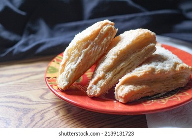 Turnovers Apple, Apple Pie, placed on an orange plate. with paper napkins Turnovers Apple is a popular dish in America