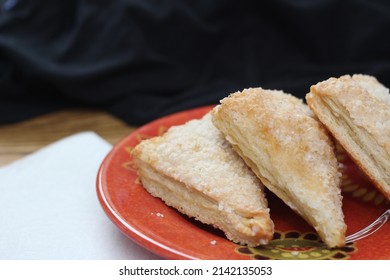 Turnovers Apple, Apple Pie, Served in an Orange Plate, Turnovers Apple is a popular dish in America.