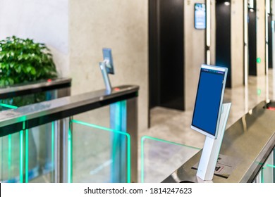 turnstile gate in office building with digital facial scaner.