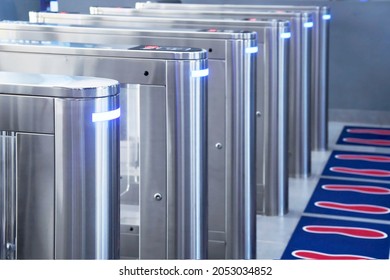 Turnstiles. Automatic access control. Access system in front of the building. Automatic electronic entrance. Entrance gate with turnstile. Selective focus on left turnstiles.