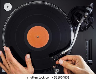 Turntable Hands Scratch And Hold Record, Top View