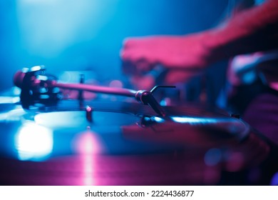 Turntable Plays Vinyl Record With Hip Hop Music On Party In Night Club. Analog Dj Turn Table Player On Concert Stage. Download Disc Jockey Photo Fro Poster Design. Disk Jokey Mixing Musical Tracks