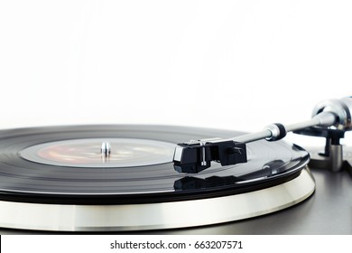 Turntable vinyl record player. Retro audio equipment for disc jockey. Sound technology for DJ to mix & play music. Black vinyl record. Vintage vinyl record player. Blurred needle on a vinyl record 