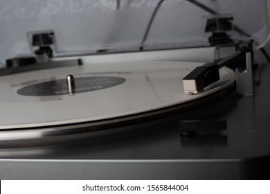 Turntable with white vinyl record. Hi-fi music lover concept - Shutterstock ID 1565844004