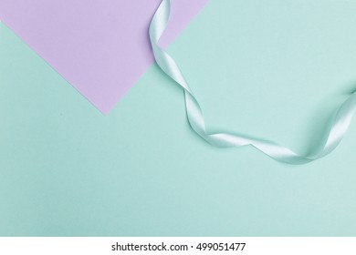 Turqoise Green Paper Background With Soft Satin Green Ribbon