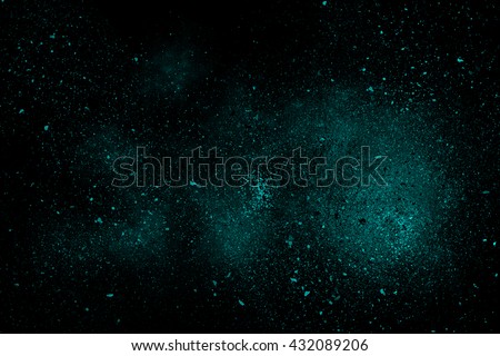 Turquoise abstract powder explosion on a black background