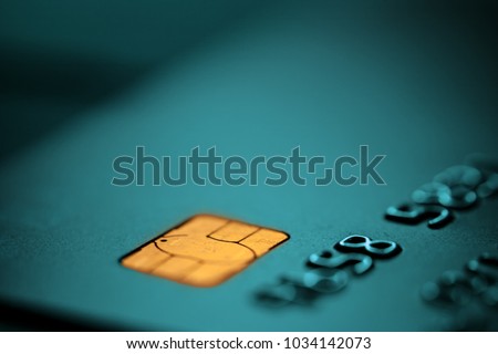 Turquoise bank credit or debit card with negative copy space, suitable for adding text, macro closeup shot 