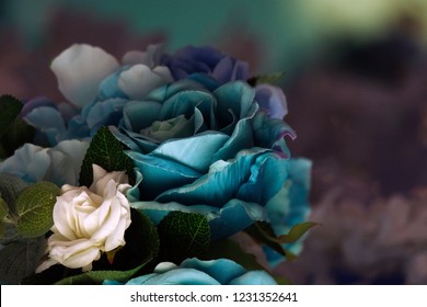 Turquoise, Blue, Purple Artificial Flowers, Collected In A Bouquet At A Wedding. Great Depth Of Field.