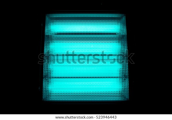 turquoise blue white square with small squares\
arranged in horizontal and vertical lines with gradient effect,\
grid against light lamps, close-up of movie illuminant divided into\
horizontal sections