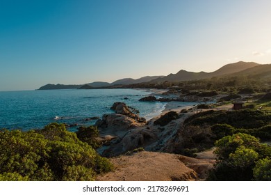 Turquoise Calm Water With Wave With Sand Beach Background Smooth And Rough Rocks And Corals Landscape Cloudy View In Sunset. Concept Summer