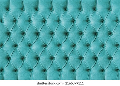 Turquoise capitone checkered soft fabric textile decorative background with buttons. Classic retro Chesterfield style, luxurious upholstery buttoned texture for furniture, wall, headboard, sofa, couch