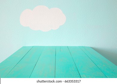 turquoise empty table and blue wall. - Powered by Shutterstock