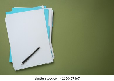 Turquoise files with blank sheets of paper and pen on olive background, top view. Space for text - Powered by Shutterstock