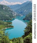 Turquoise lake in the mountains, Montenegro. Piva national park. Pivsko oko, Pluzine, Montenegro