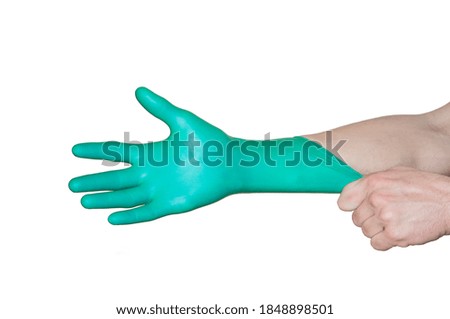 turquoise medical glove on the hand. Medical safety and hygiene. the image illustrates the concept of purity.