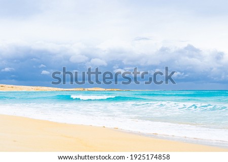 Turquoise Mediterranean sea at El Alamein near Alexandria, Egypt, with storm clouds gathering