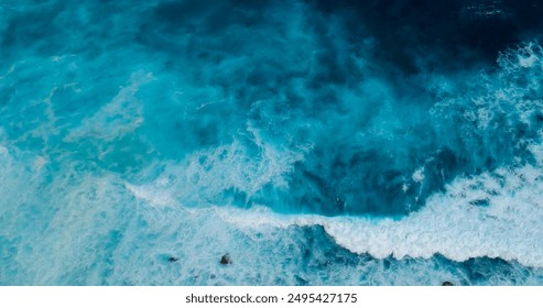 Turquoise ocean sea water white wave splashing deep blue sea. Bird eye view monster wave splash on rock. Tropical sea beach in summer seaside outdoor. Ocean island beautiful dramatic landscape. - Powered by Shutterstock