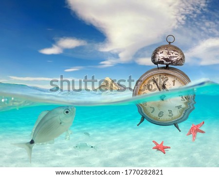 turquoise ocean with underwater view and clock, global warming of the oceans, time to change, concept for environmental protection