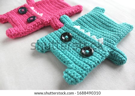 Turquoise and pink handmade crocheted mosters