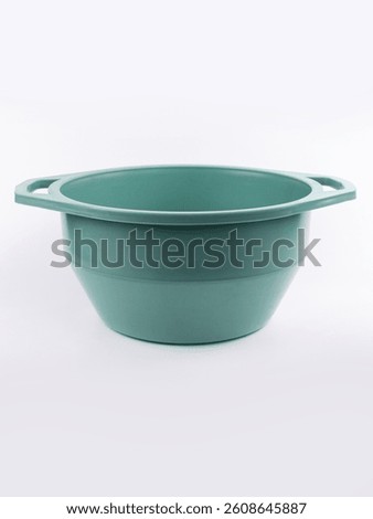 Turquoise plastic empty basin isolated on white background
