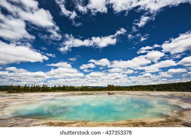 Turquoise Pool, a hot spring, with reflection in the Midway Geyser Basin of Yellowstone National Park, Wyoming